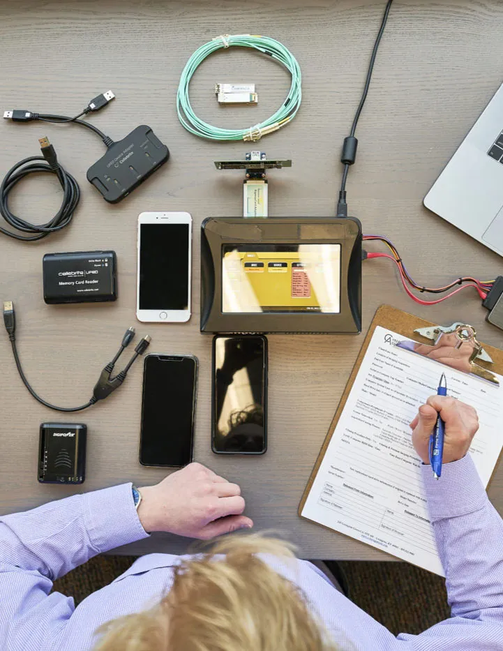 A Cyber Agents examiner reviewing recovered digital evidence at a forensic workstation.